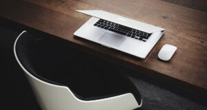 The hand rail is going a little faster than the moving sidewalk.